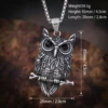 Norse & Gothic Stainless Steel Owl Necklace Pendant size Detailed silver-tone owl pendant necklace perched on a branch with black crystal eyes, displayed against a solid white background. size