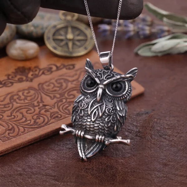 Norse & Gothic Stainless Steel Owl Necklace Pendant thin chain Detailed silver-tone owl pendant necklace perched on a branch with black crystal eyes, displayed against a solid white background.