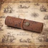 Dark brown faux leather roll-up pencil case with vintage treasure map design and embossed buckle 3